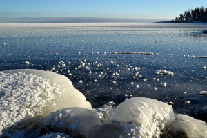 A winter dream in Scandinavia: Frozen Lake Vaner in Sweden on a calm and sunny winter day